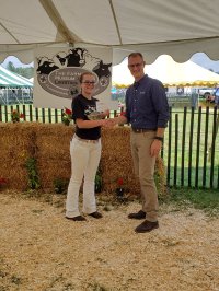 Hannah accepting scholarship from Chobani representative